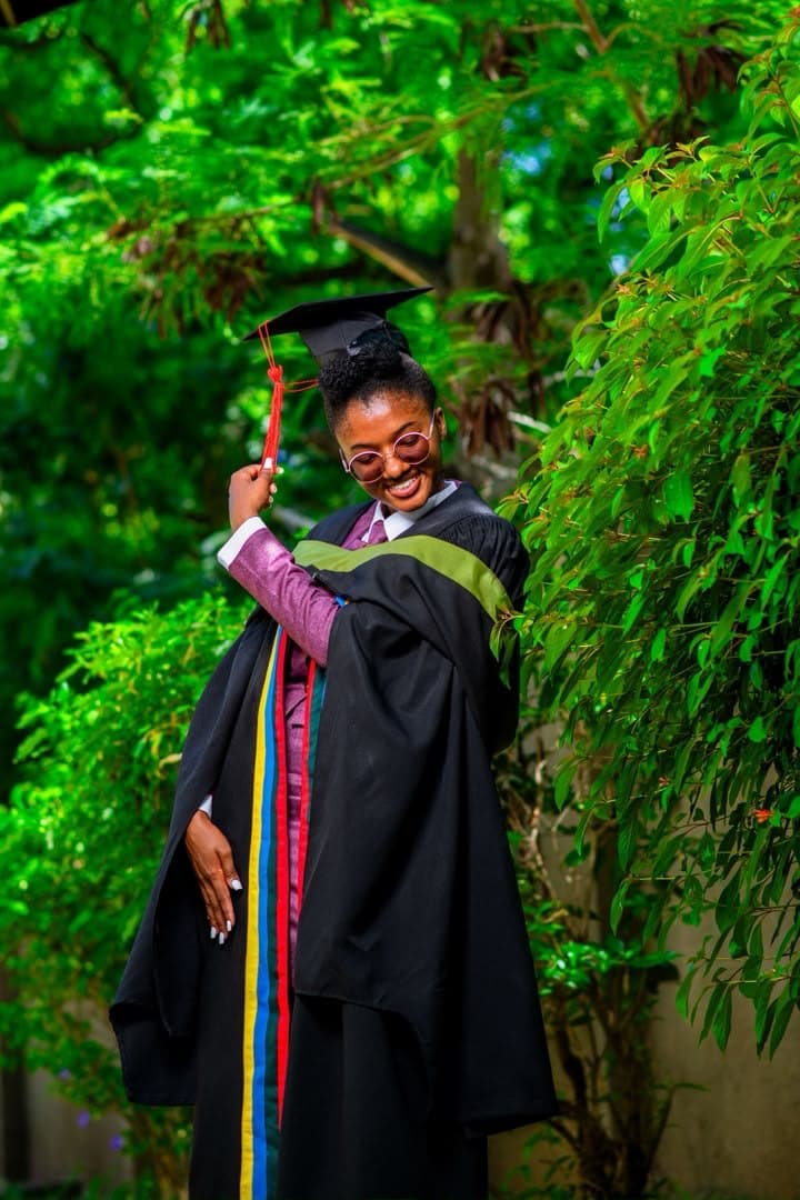 Cap thrown, gown on