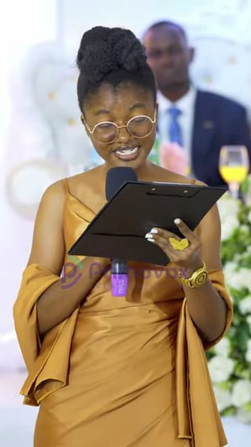 Reading a poem written for the couple