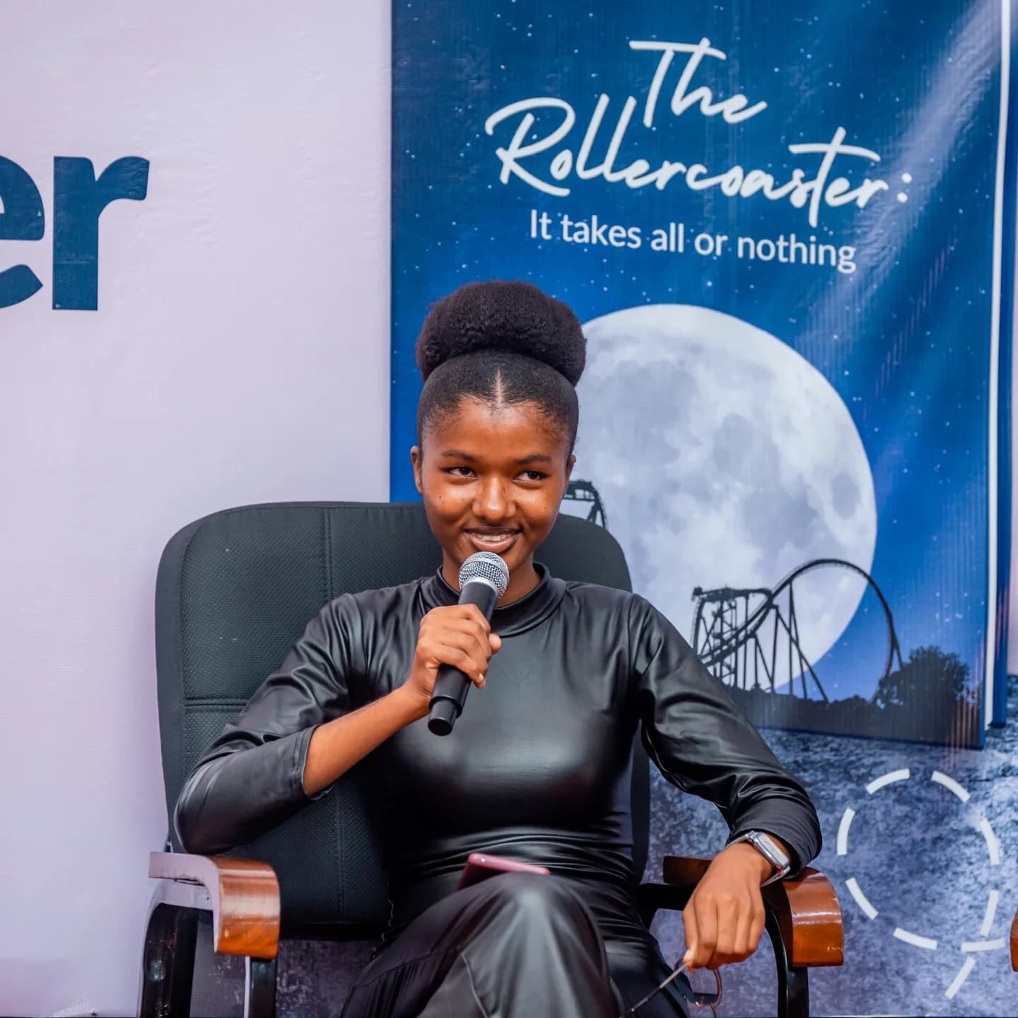In front of the launch banner